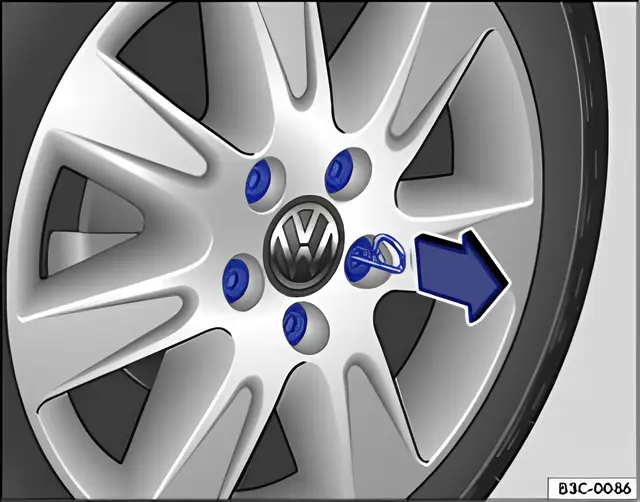Fig. 167 Removing the wheel bolt caps