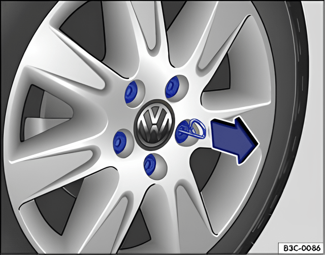 Fig. 167 Removing the wheel bolt caps